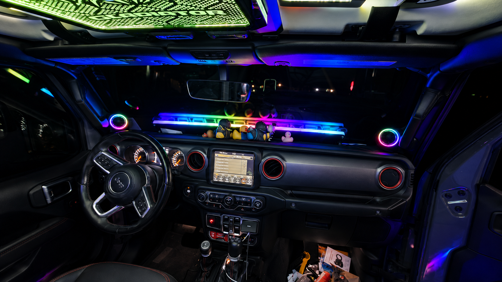 Lit FX Jeep JL JLU JT engraved LED Freedom Panel set installed on the factory front roof panels