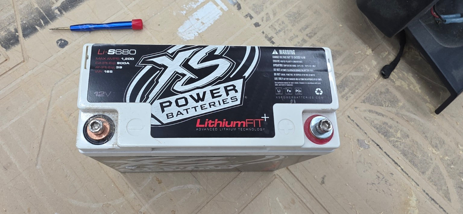 Used XS Power Li-S680 12V lithium battery top label showing 1200 max amps 900A lead-equivalent cranking and 165Wh