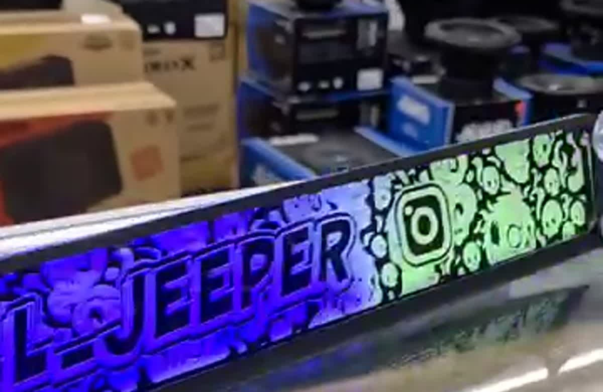 Lit FX custom engraved LED dash plaque illuminated on the SMS Car Audio counter