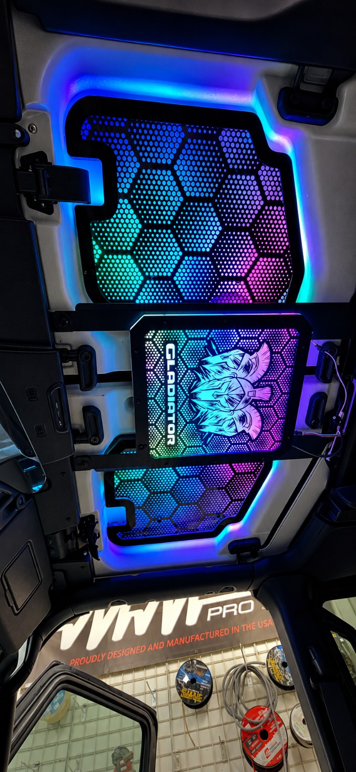 Lit FX Jeep JL JLU JT front Freedom Panels installed with RGB lighting; overhead MOLLE rack and center panel shown but not included