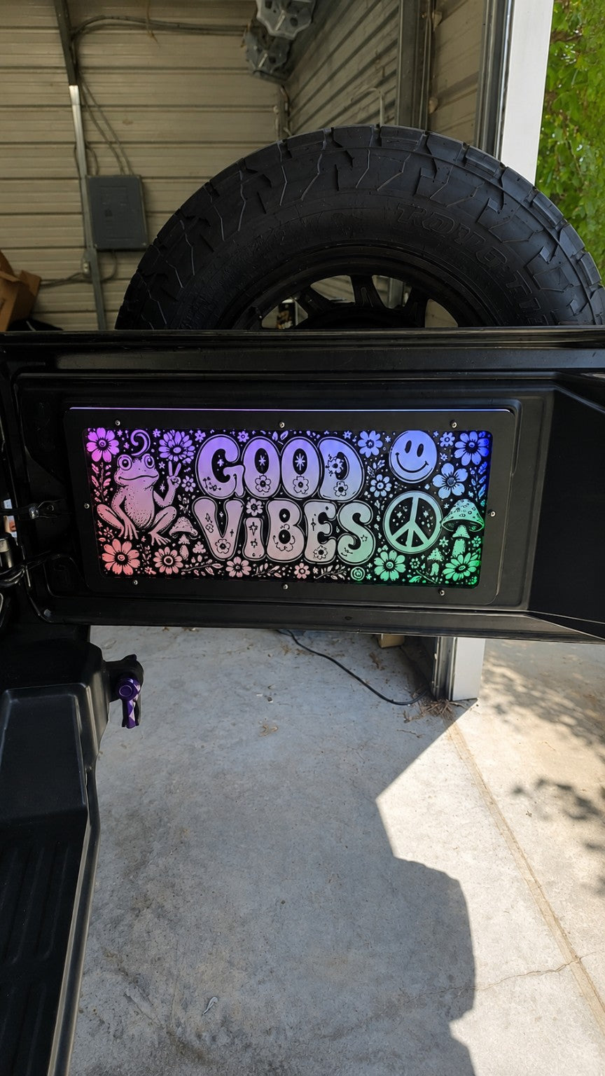 Lit FX custom engraved Jeep tailgate LED panel with Good Vibes artwork and multicolor LED illumination