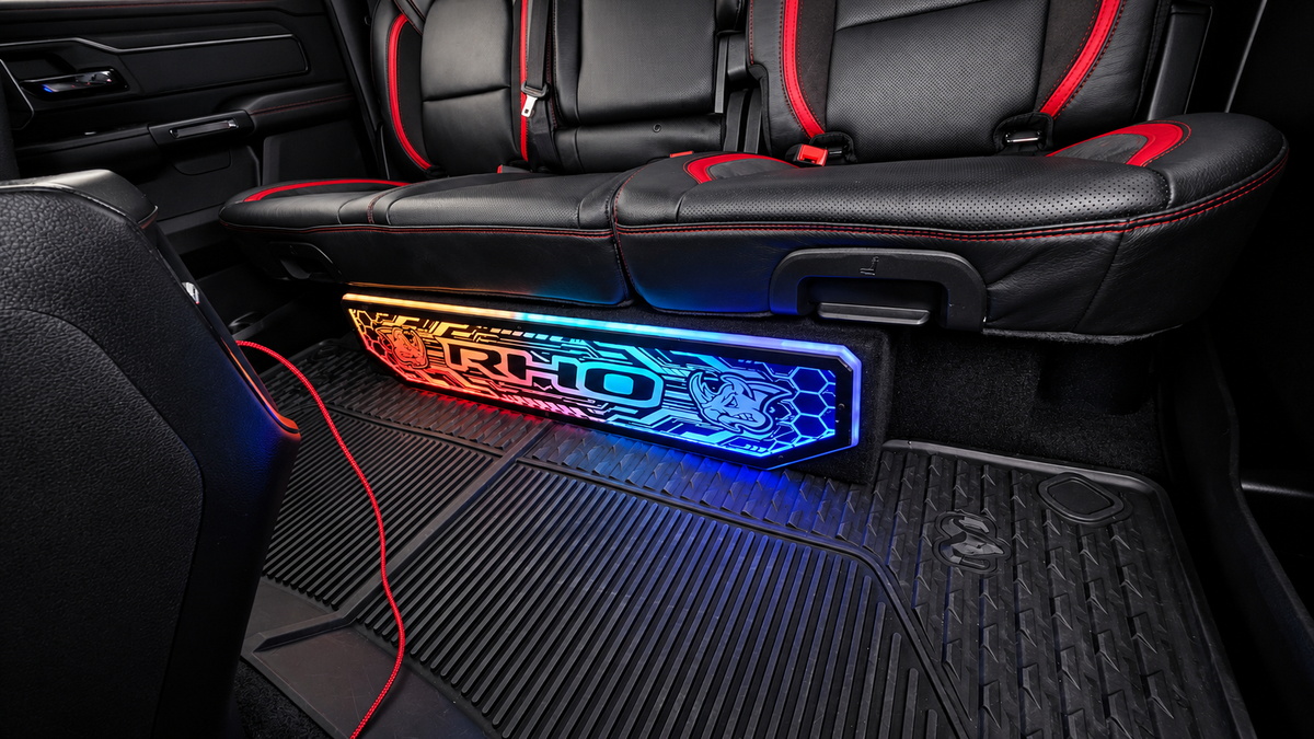 Lit FX RHO plaque with RGB lighting installed on RAM KICKER truck enclosure
